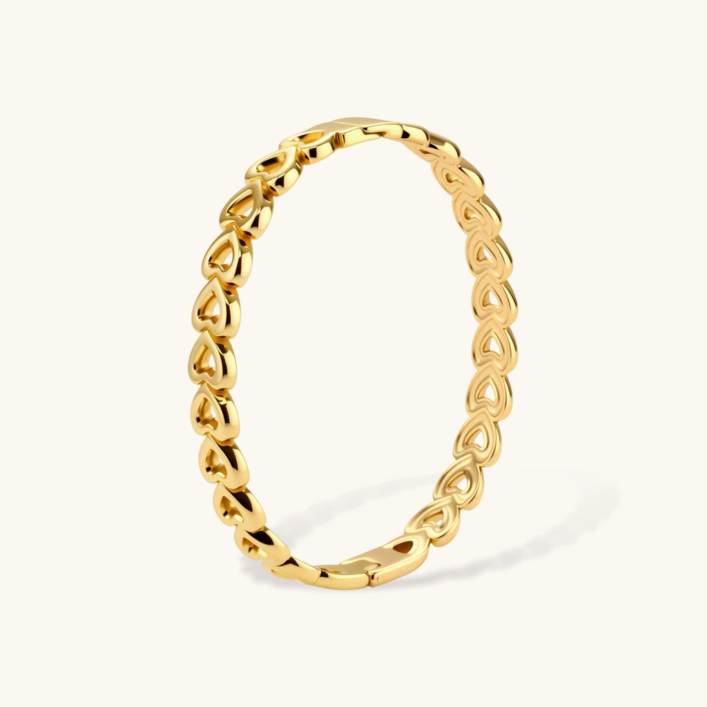 Heart-link gold-tone bangle close-up