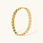 Heart-link gold-tone bangle close-up