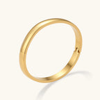 Polished gold-tone bangle close-up