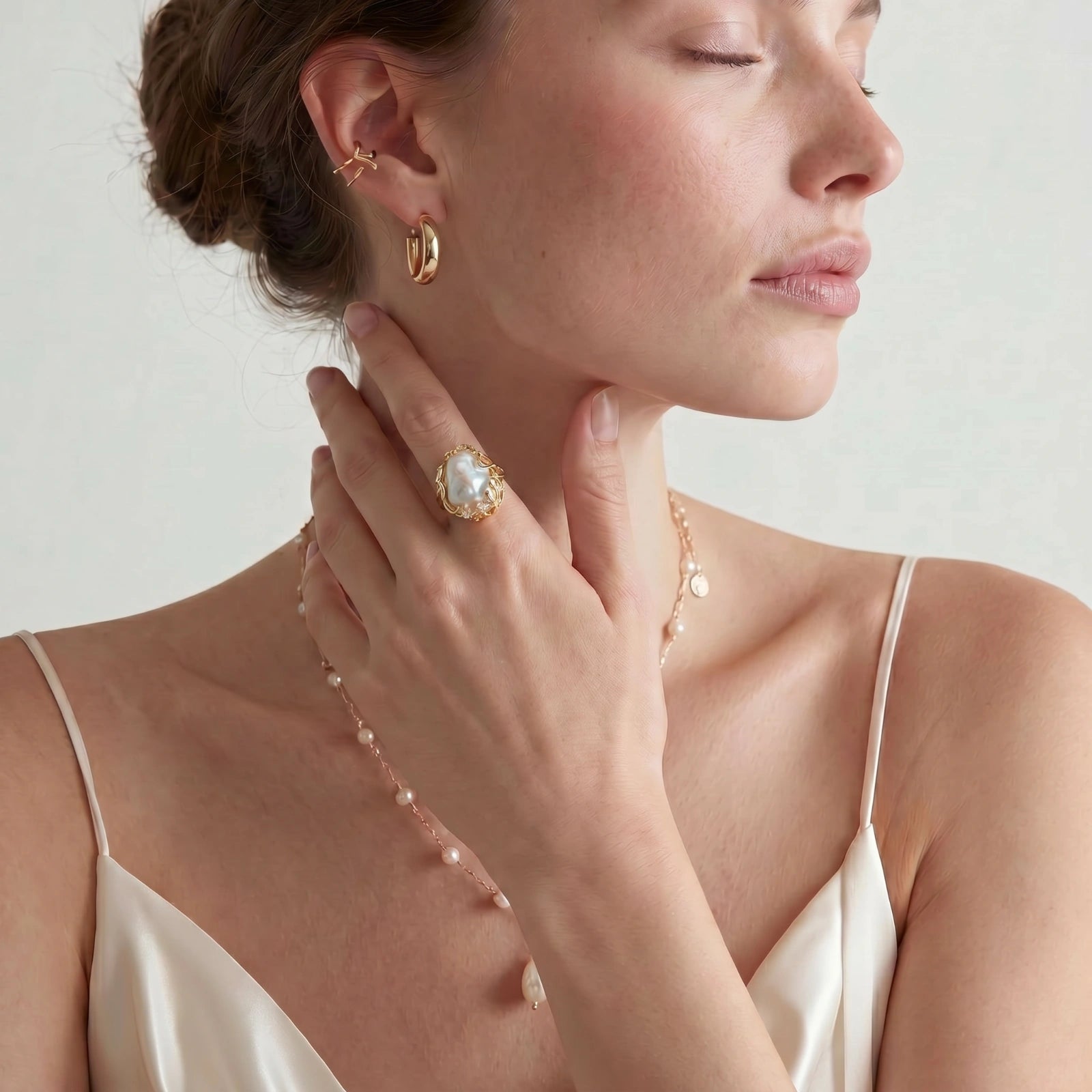 Baroque pearl crown ring on white background