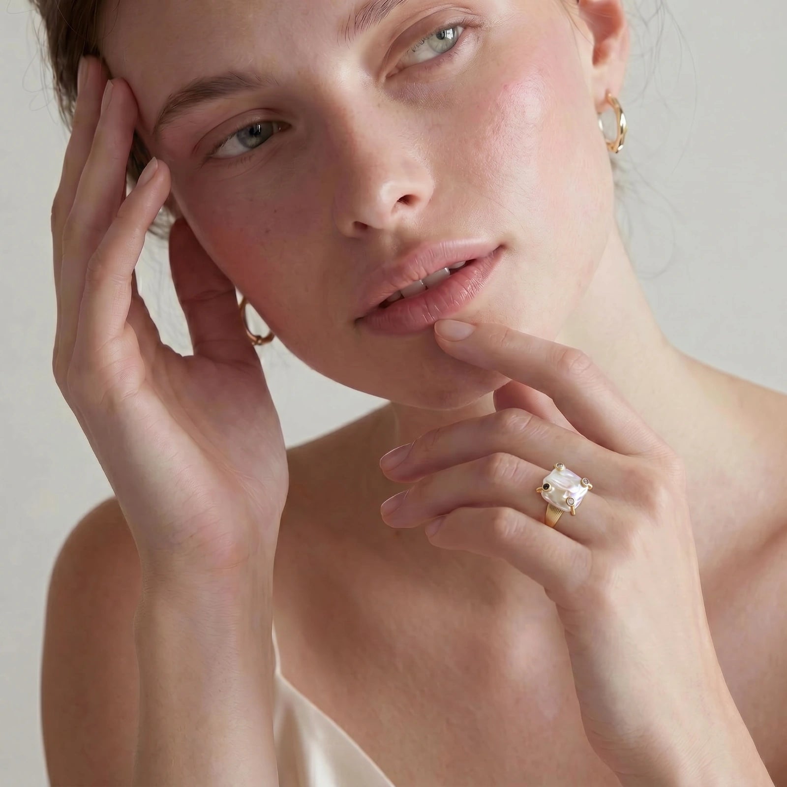 Baroque pearl statement ring on white background