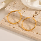 Hoop earrings on white background