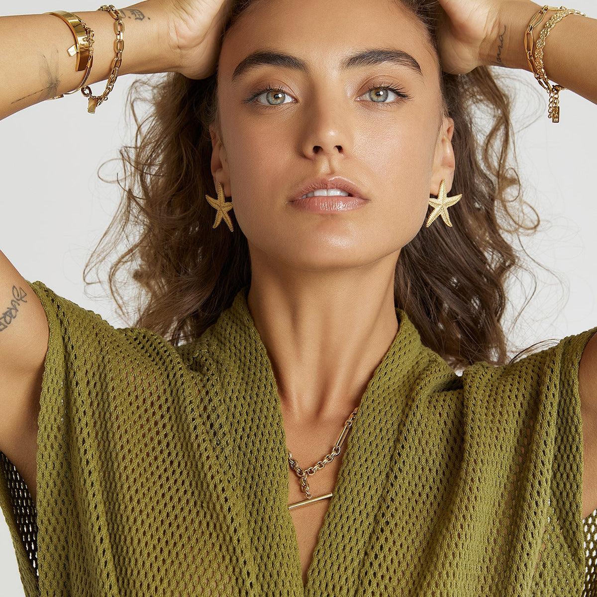 Starfish earrings shown on model