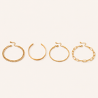 Gold-tone chain bracelets on white background