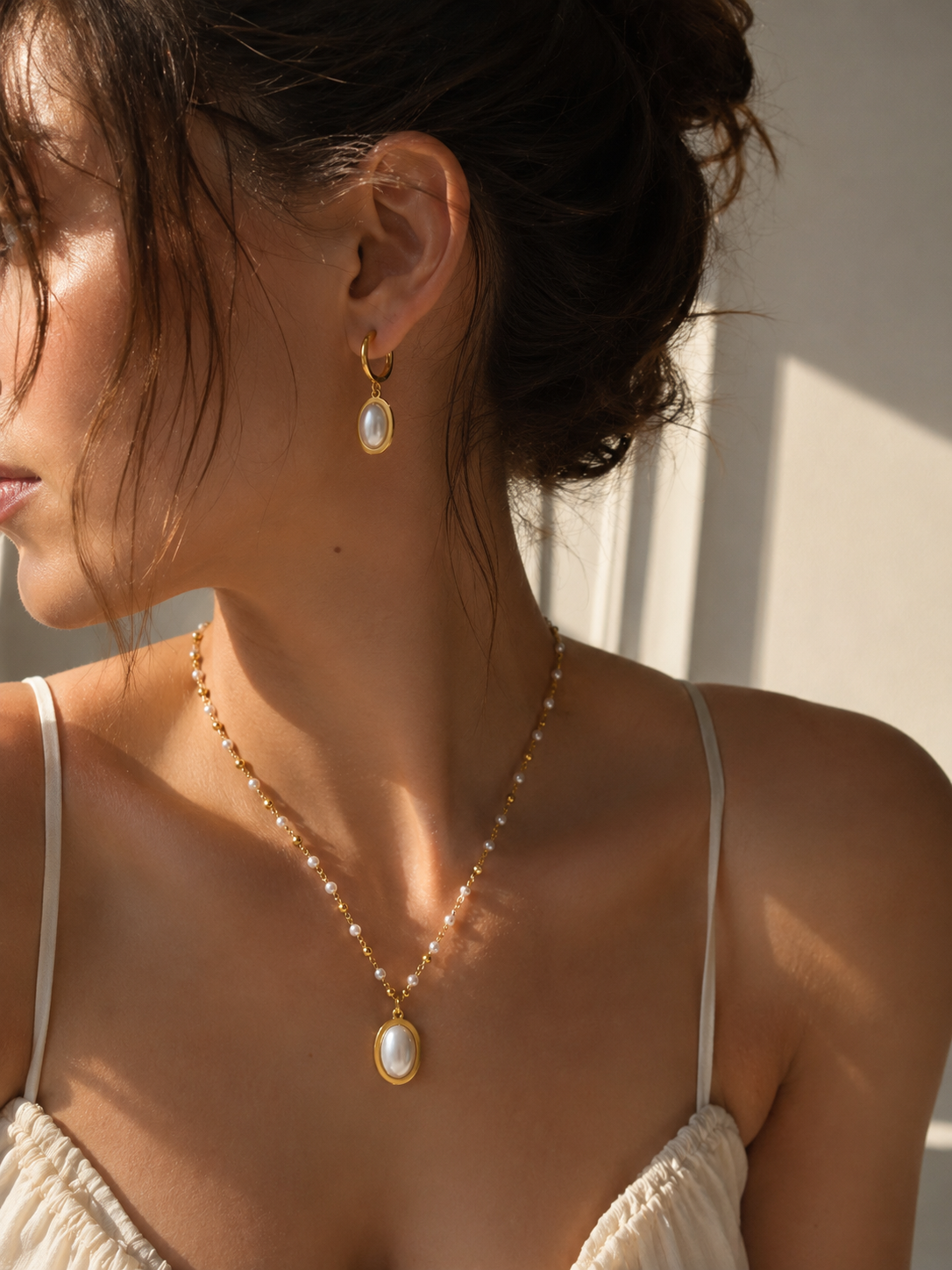 Necklace and earrings shown on model