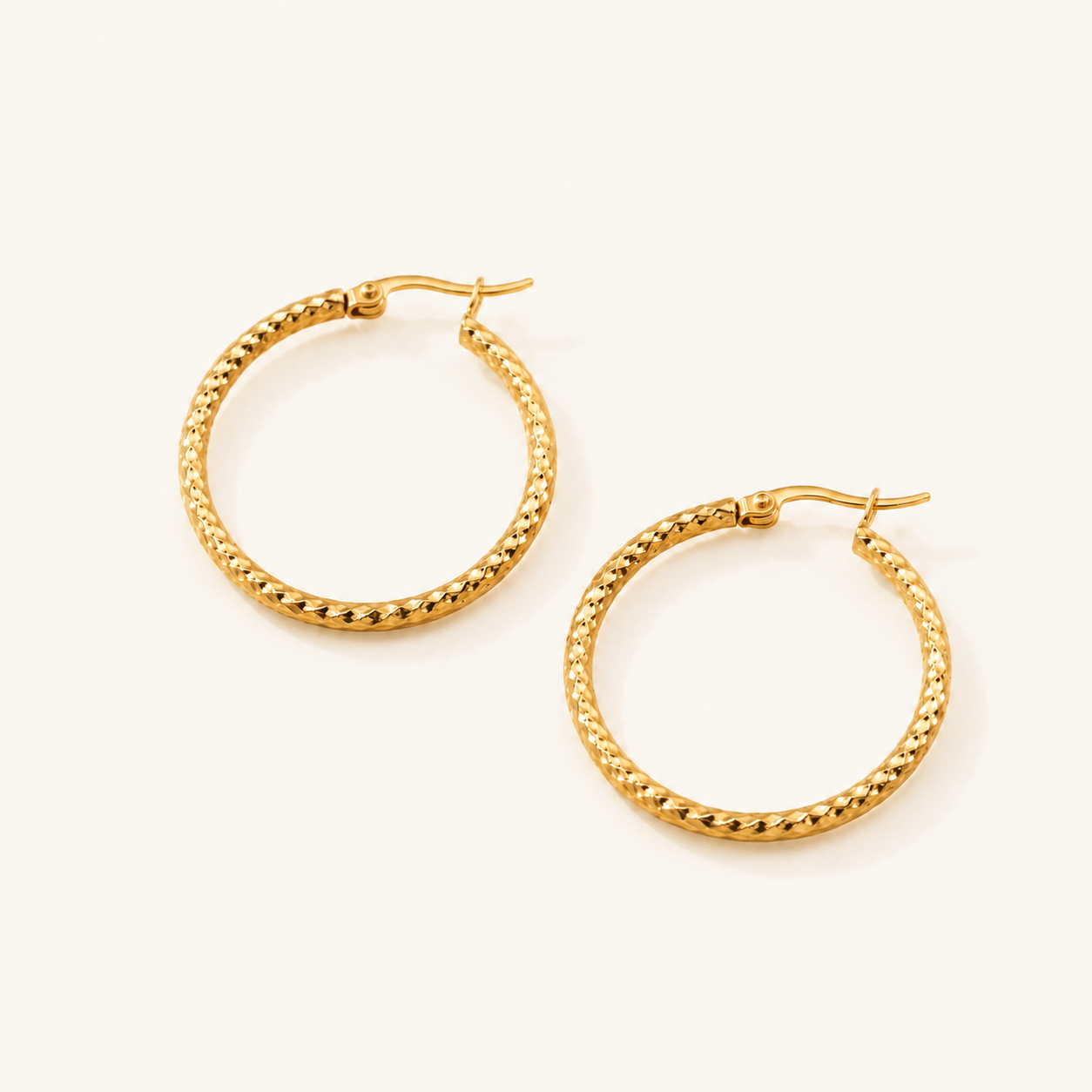 Embossed hoop earrings close-up