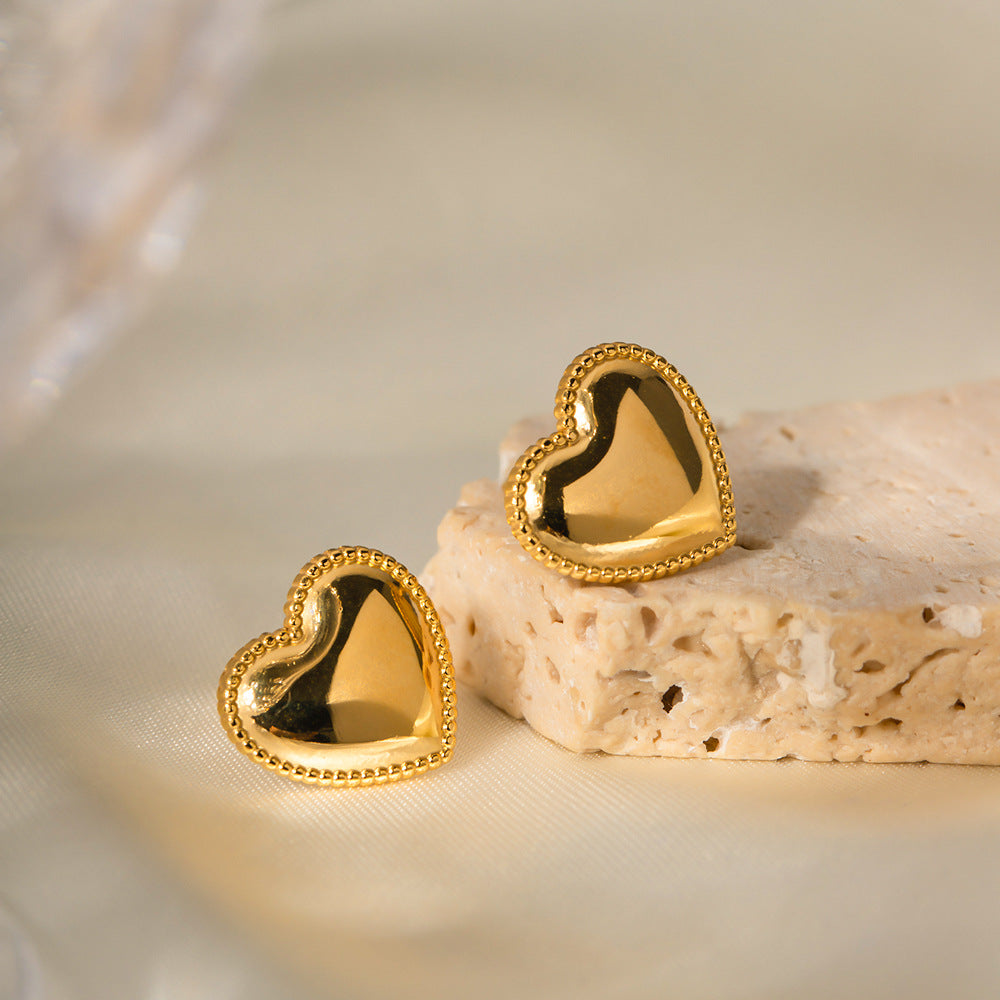 Heart stud earrings angled view