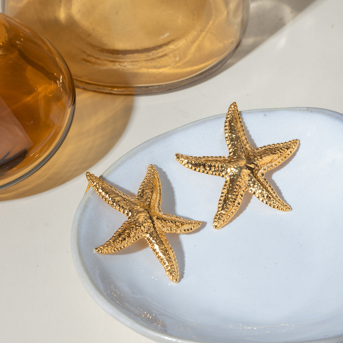 Starfish studs on white background
