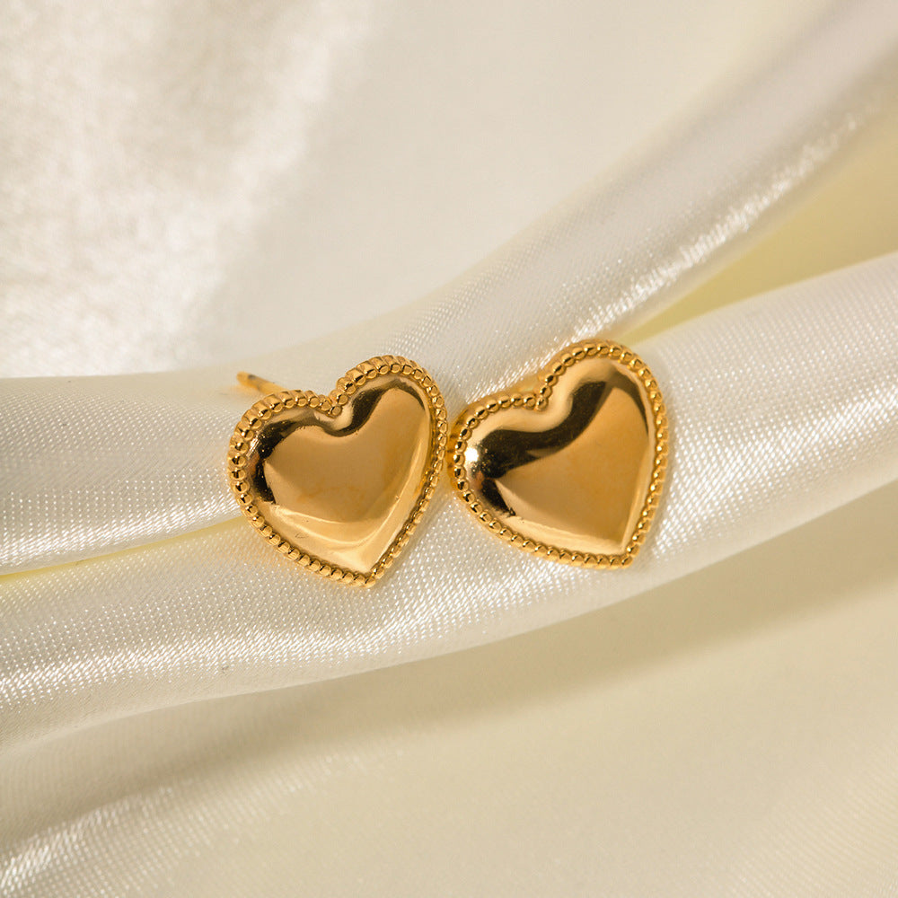 Heart studs on white background